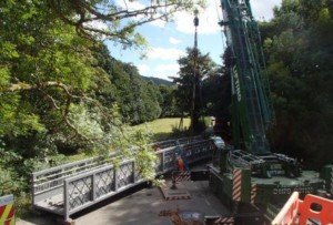 Bridge being lifted into place for the Wray Valley Trail joining Bovey Tracey and Moretonhampstead through Lustleigh close to Three Pound Cottage the self catering dartmoor holiday accommodation